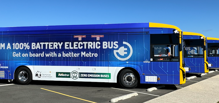 The four Metro battery electric buses. On the side of each bus is written "I'm a 100% battery electric bus. Get on board with a better Metro."
