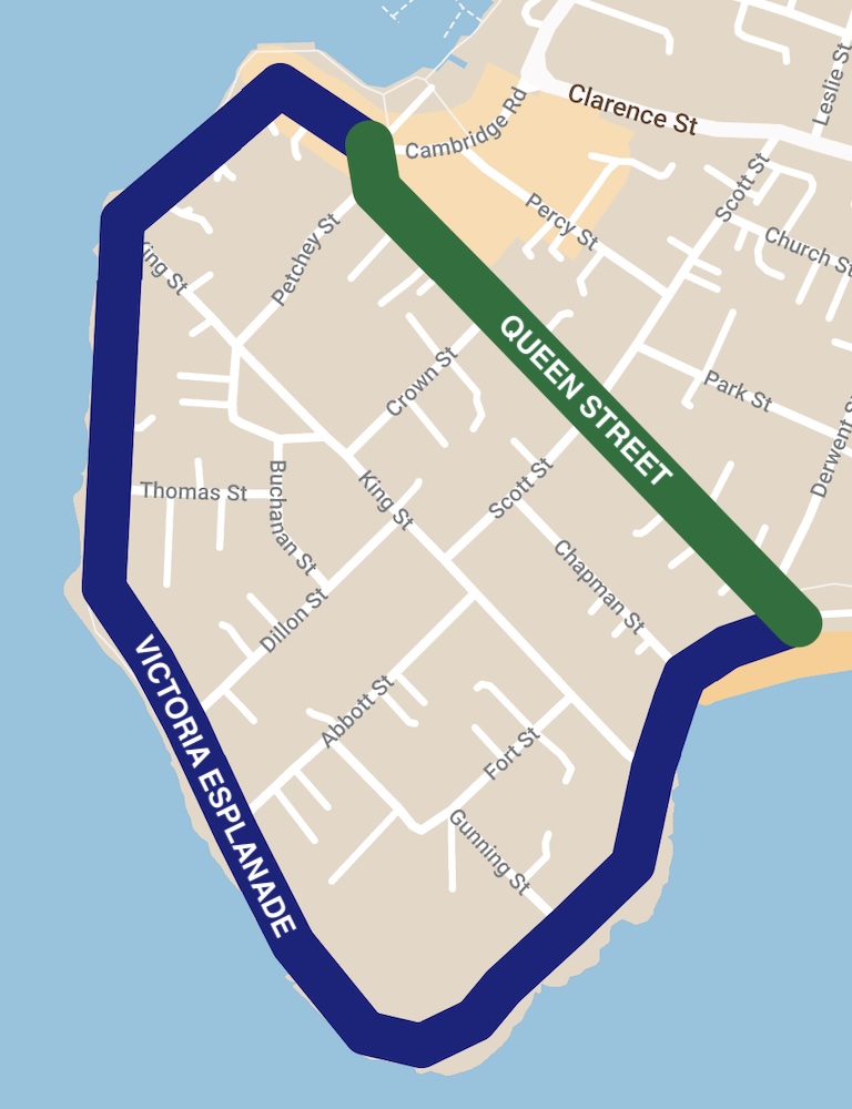 A map showing a bluff. A street straight across the waist of the bluff is marked Queen Street. A street around the coast of the bluff is marked Victoria Esplanade.