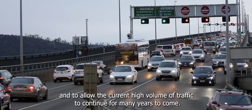 A photo of the Tasman Bridge crammed with traffic. A caption reads "and to allow the current high volume of traffic to continue for many years to come".