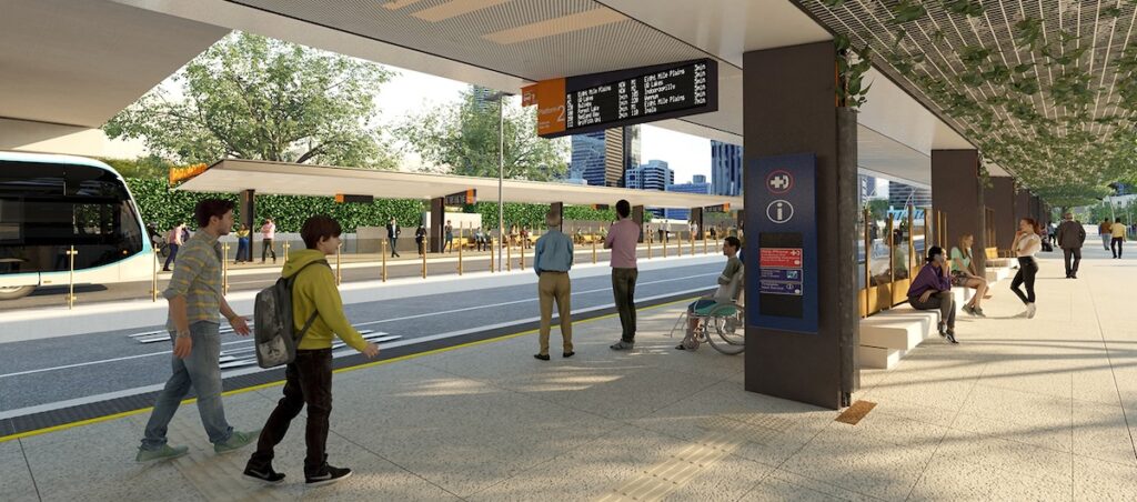 An artists impression of a bus rapid transit station. There's a bus entering the station on a road dedicated to buses. There's people walking, standing and sitting on the platform. There's an electronic sign listing expected buses. There's lots of greenery.