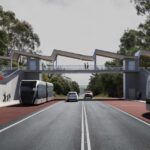 An artists impression of a modern looking bus rapid transit station. People are waiting on covered platforms. A red sign read "Towards Hobart". Two sleek silver articulated buses are driving in opposite directions on red lanes marked"Priority Lane". Cars drive in both directions on two general traffic lanes between the bus lanes. Stairs lead to a pedestrian overpass connecting the two platforms.